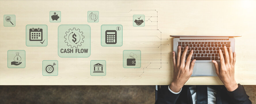 Businessman Managing Cash Flow with Laptop on Desk Surrounded by Digital Financial Icons and Graphs for Effective Financial Planning and Analysis. Glyphic.