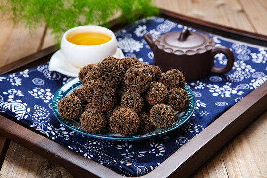 Dried Liquidambar Fruits on Ancient Chinese Paper Scroll