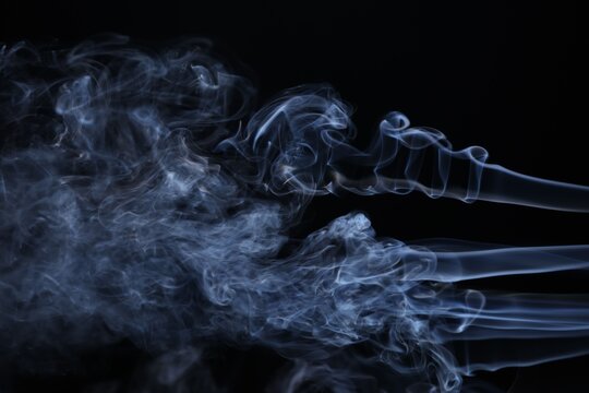 Beautiful smoke in light on black background