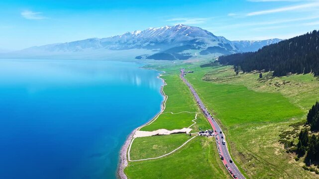 Aerial view of a scenic highway along the shore of Sayram Lake in Xinjiang, China