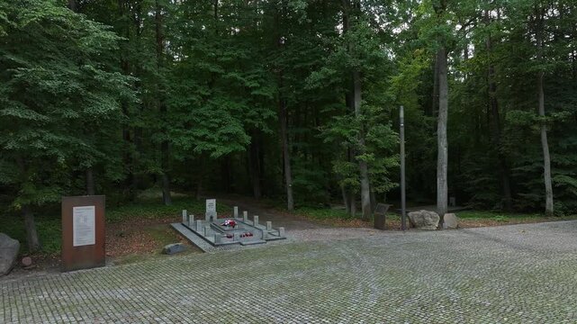 Aerial Starogard Poland WWII monument to murder grave 2. 7,000 Polish civilians, intellectuals, Jews, and psychiatric patients murdered by Germany during WW II. Memorial is mass graves. Historical.