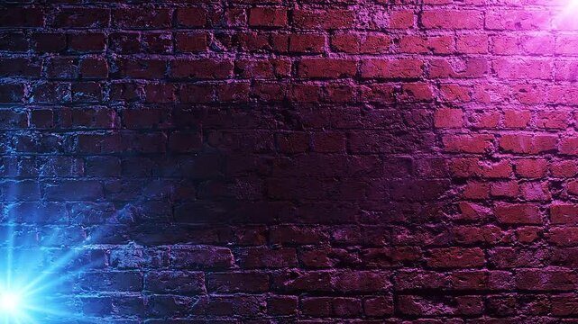 Red brick wall background illuminated by vibrant blue and magenta neon light beams for a dynamic video motion texture effect