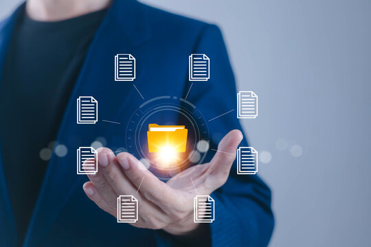 Business professional managing digital documents with a secure folder interface, representing document management, cloud storage, file organization, data access, workflow, and office technology tools.