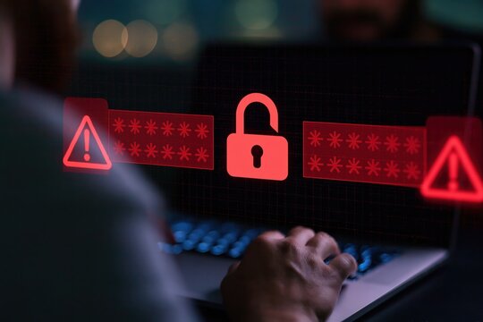 Cybersecurity threat with digital lock and warning signs on laptop screen during a data breach and system hack