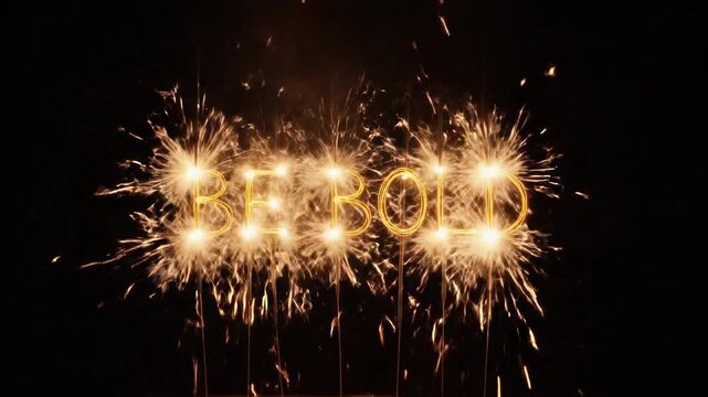 Sparkler text spelling Be Bold against a dark background. Suitable for holiday, greeting, celebration, banner, promotion, project.