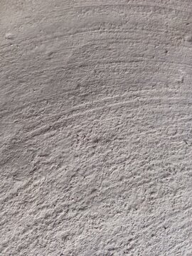 Curved smooth grey concrete wall surface texture