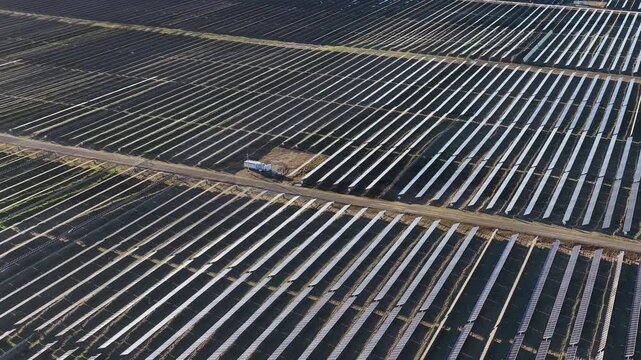 Aerial View of Large Scale Solar Panel Farm Array