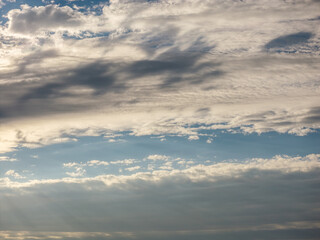 Fototapeta premium Blue sky with fluffy white cumulus clouds on a clear day