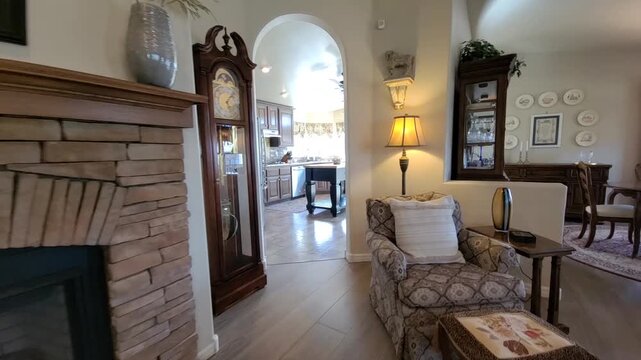 Cozy living room with stone fireplace and open kitchen