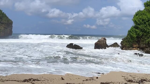Rugged rocks stand firm against crashing ocean waves
