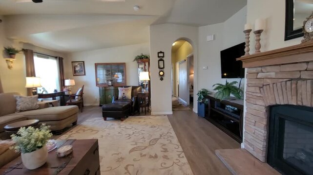 Cozy living room with warm fireplace and sunlight