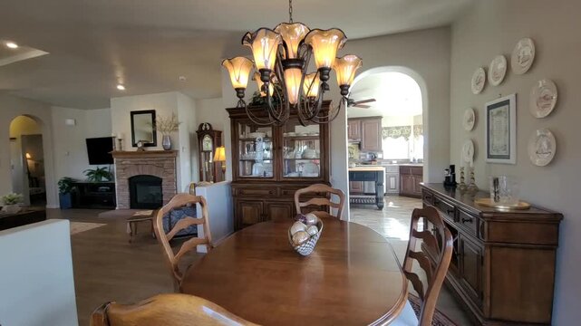 Cozy dining room with wooden table and chandelier