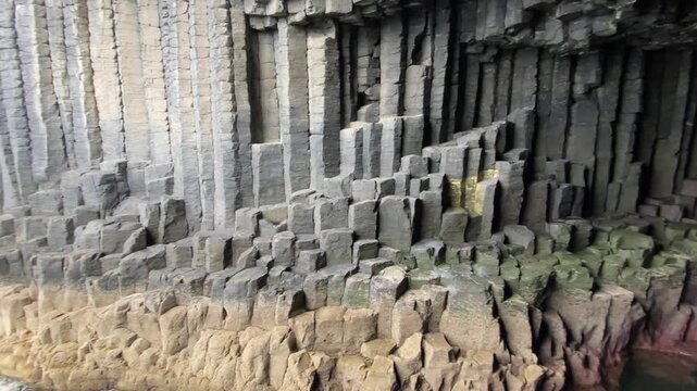 Naturally formed basalt columns in a cave wall with fascinating geological patterns, Fingal's Cave, Staffa, Inner Hebrides, Scotland, Great Britain