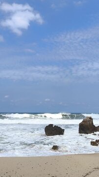 Rugged rocks stand firm against crashing ocean waves