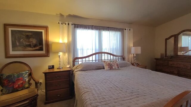 Cozy bedroom with warm lighting and soft fabrics