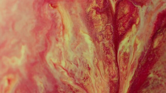 Ink wave. Color blend. Defocused red yellow glitter texture spatter flow liquid floating on abstract acrylic creative art background.