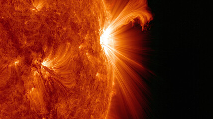 A massive solar flare erupts from the surface of the sun and sends bright plasma rays into the deep dark space of the universe © AS_SleepingPanda