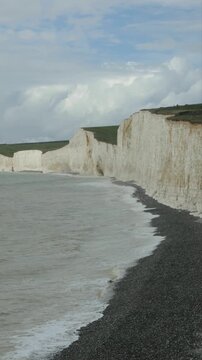Clouds, waves, sea, beach, chalk cliffs Seven Sisters, Birling Gap near Eastbourne, East Sussex, England, Great Britain