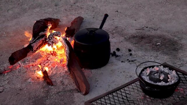 Cooking dinner in the evening in the salt desert, Makgadikgadi Pans National Park, Botswana