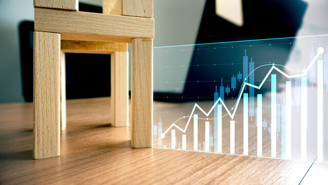 Real estate investment growth, Enterprises and property market financial chart. with candlestick display and wooden blocks.