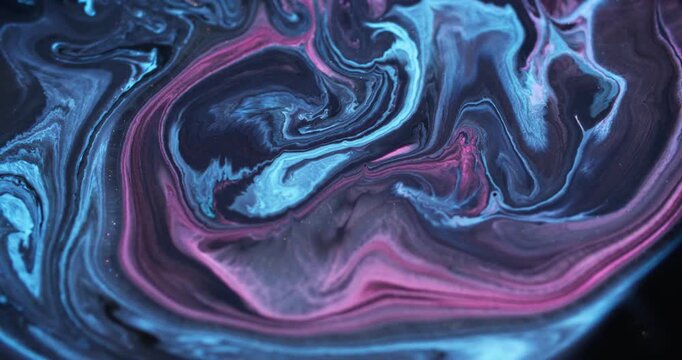 Shiny ink. Acrylic flow. Blur blue pink purple color mix sparkling marble texture glitter fluid floating on abstract art background.