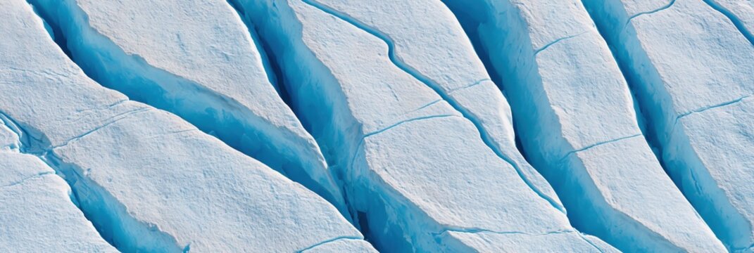 Deep blue glacier crevasses with parallel ice formations and abstract texture