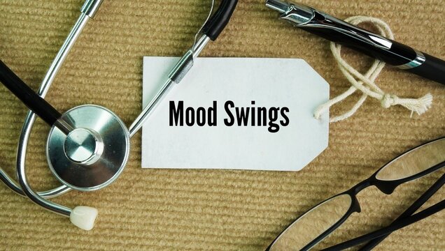 Stethoscope and paper tag with the words Mood swings are sudden, rapid, or extreme changes in a person's emotional state or feelings.