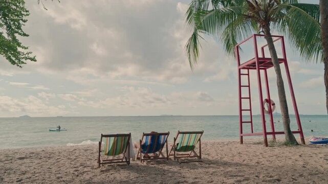 Red Lifeguard Tower and Beach Chairs on Tropical Sand Beach in Summer, 4K Video