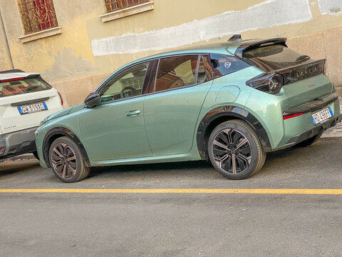 Lancia Ypsilon 2024 Cassina Limited Edition electric hybrid car parked on an urban street in Italy