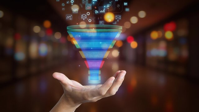 A glowing digital sales funnel hologram hovers above a businessman hand against a blurred background. Perfect for data analysis and marketing strategy presentations.