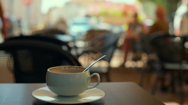 Empty Coffee Cup On Cafe Table With Blurred People Background
