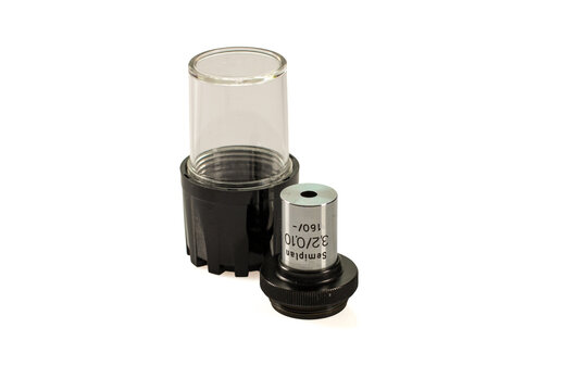Semiplan 3.2x microscope objective with 0.10 numerical aperture and 160 mm tube length, shown with its protective holder.