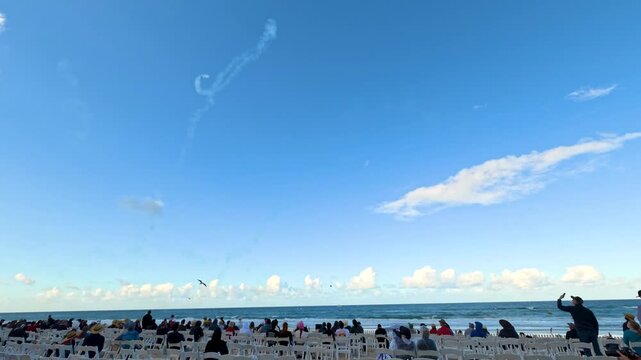 Crowd Watching Airshow Smoke Trails at Surfers Paradise Beach