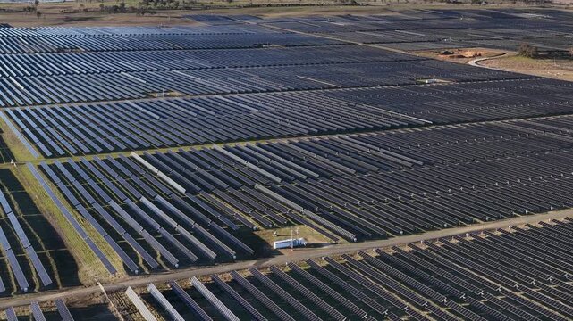 Aerial View of Vast Solar Farm Generating Clean Renewable Energy