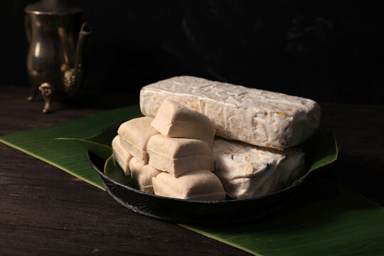 Stacked tofu and tempeh pieces and soybeans as vegetarian plant protein foods