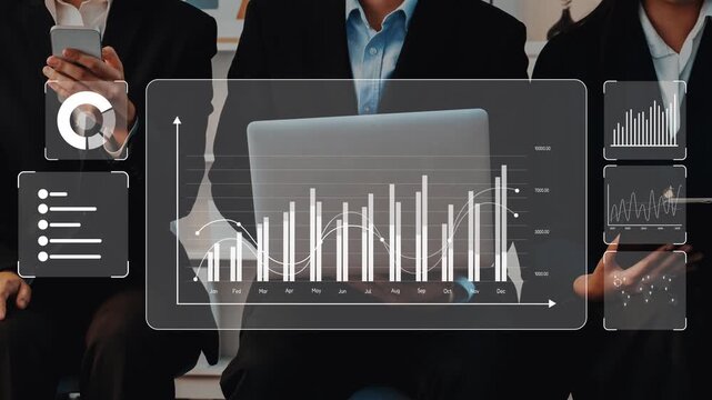 Business professionals engage in data analysis with the help of digital graphs and charts displayed on a laptop, illustrating modern teamwork in a corporate office. Raster