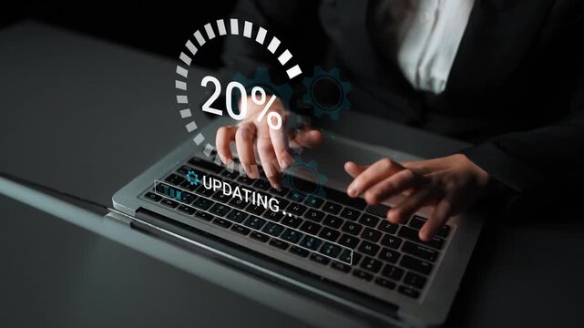 Person in Business Attire Typing on Laptop with Digital Progress Indicator Graphic Representing Data Update Process in Modern Office Setting. Entropy.