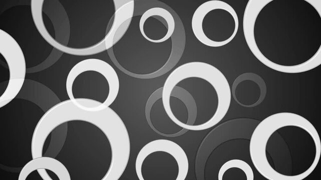 Stylized abstract background with overlapping white rings on dark radial gradient animation, modern minimalist pattern