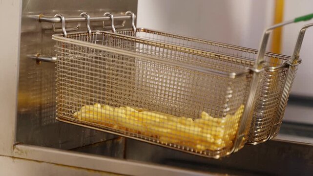 French Fries in a Commercial Deep Fryer Basket