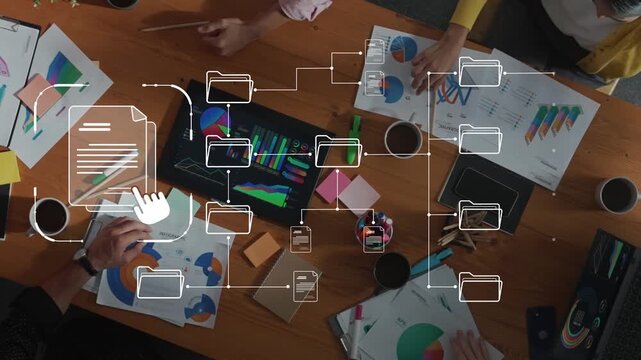 A diverse business team collaborates in a modern workspace, engaging in data analysis and discussions around charts and digital tools to boost productivity. Raster