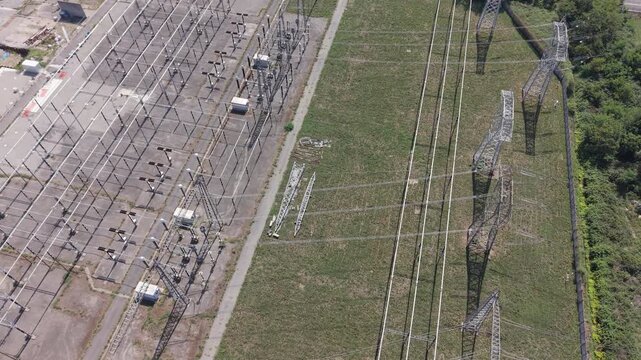 Electricity Transmission Substation with High Voltage Lines and Industrial Equipment