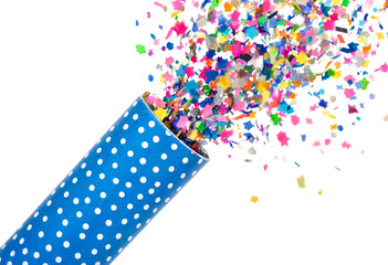 Obraz premium Colorful confetti bursting from blue polka dot party popper tube