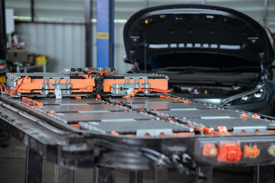 Lithium-ion High-voltage Battery Component for Electric Vehicle or Hybrid Car. Battery Module for Automotive Industry on Production Line. High Capacity Battery Production inside a Factory.