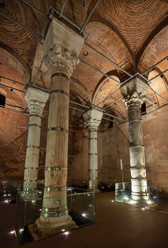 Interior of the historic Theodosius Cistern in Istanbul, Turkey, featuring ancient marble columns and illuminated vaulted brick ceilings showcasing Byzantine architectural heritage