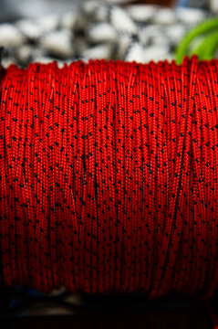 Red and black cord spool close up