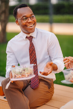 African american businessman enjoying healthy lunch outdoors