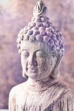 Meditating Buddha Statue on wooden background. Soft focus. Close up. Copy space