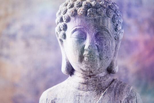 Meditating Buddha Statue on wooden background. Soft focus. Close up. Copy space