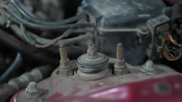 Close-up of a car front shock absorber top mount studs.