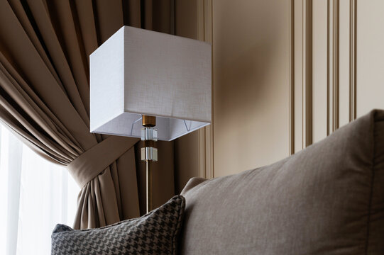 Modern living room interior detail with floor lamp and sofa